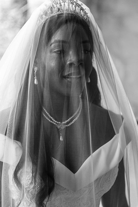 Megan beneath her veil on the morning of her wedding, black and white